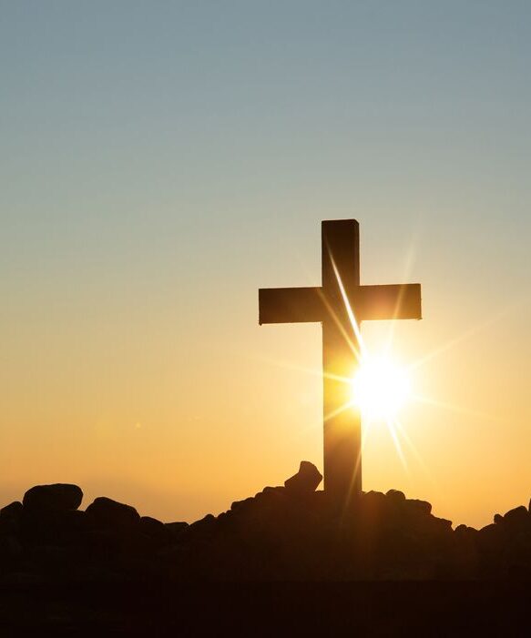 Sun setting behind a cross. Christian, Christianity
