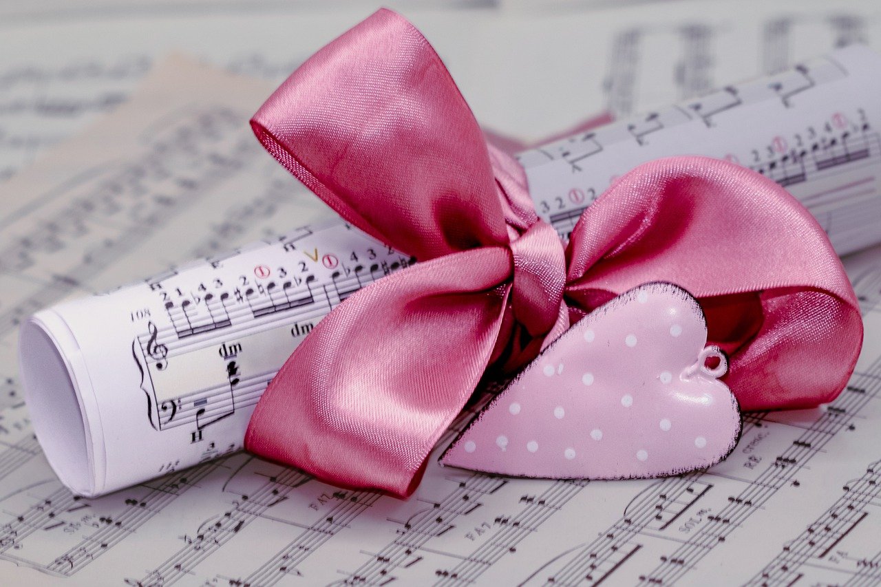 Sheet music tied with a pink ribbon